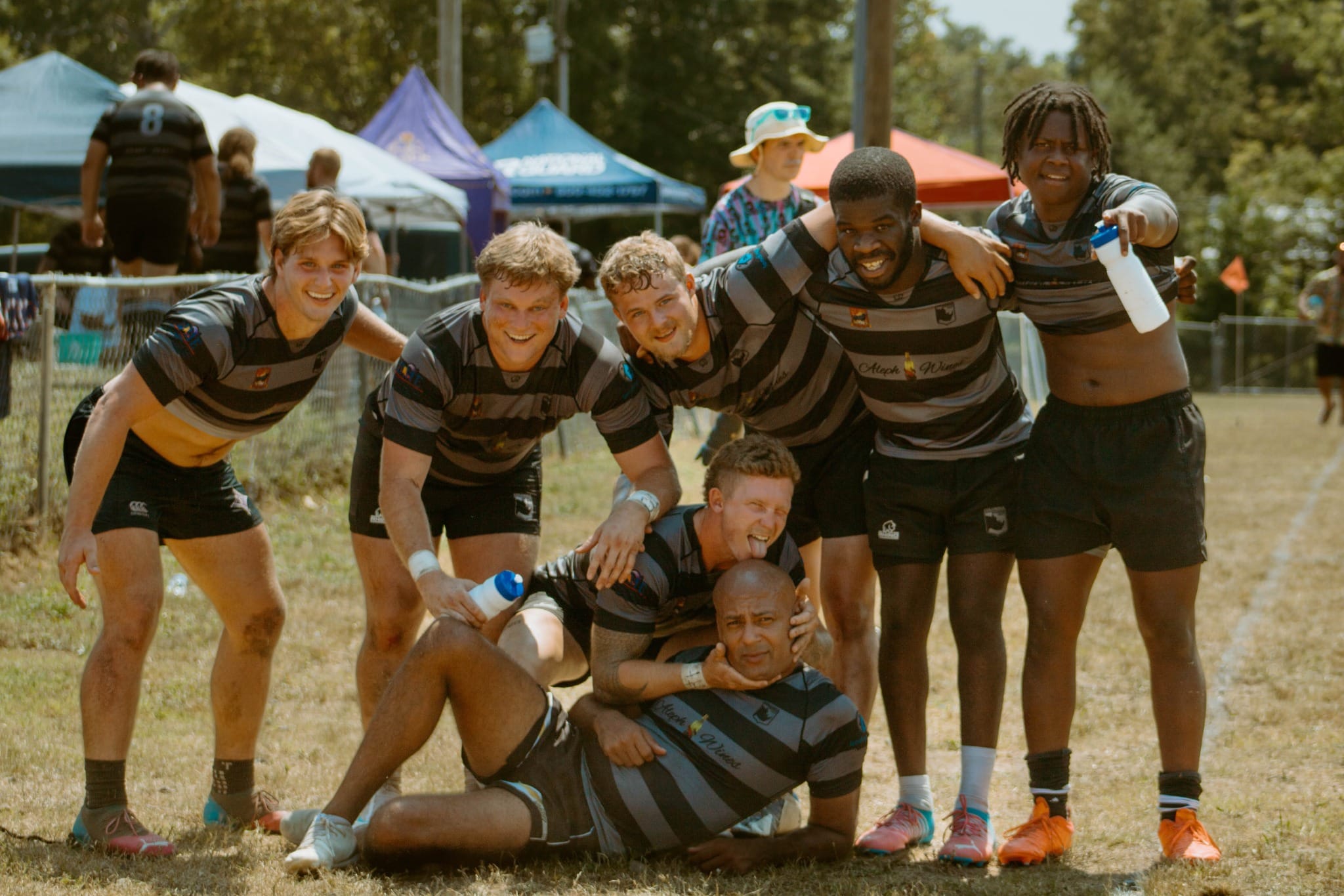 Columbia Rhinos teammates posing together after playing